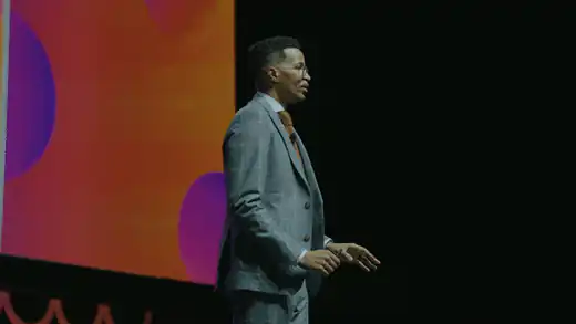 Ryan Leak on stage in front of a packed arena